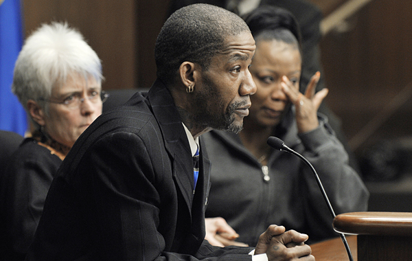 LaDonna Lampkin, right, wipes away a tear as Aaron King, center, tells about his homelessness during a hearing of the House Housing Policy and Finance and Public Health Finance Division March 5. Both are participants in the New Foundations program, and are joined at the table by the program