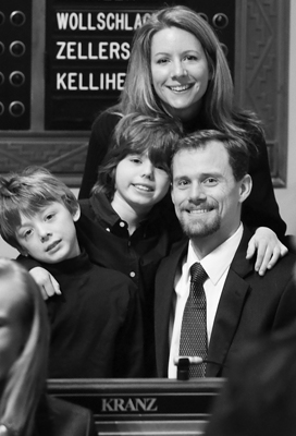 Rep. Scott Kranz is joined at his desk in the House Chamber by his wife, Kristi, and sons, Ryan, left, and Lucas, center, at the opening of the 2007 session. (Photo by Tom Olmscheid)