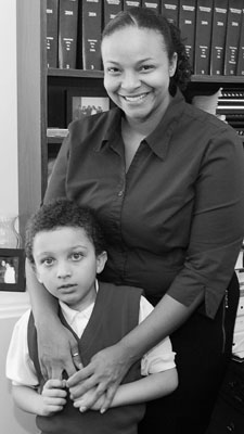Rep. Neva Walker enjoys the company of her best friends’ nephew, Kenney Gatlin Jr., in her State Office Building office. (Photo by Andrew VonBank)