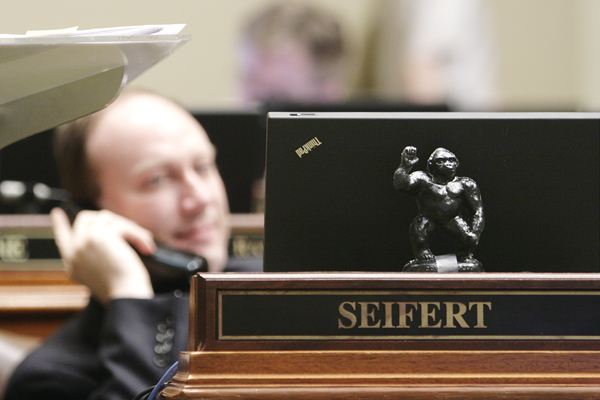 A miniature toy gorilla sits on the desk of House Minority Leader Marty Seifert, symbolizing a component of the capital investment bill that has been a target of his criticism. Included in the bill is $11 million that, in part, would improve the gorilla living quarters at the Como Zoo in St. Paul. (Photo by Tom Olmscheid)