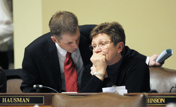 John Pollard, left, executive assistant to the House majority leader, talks with Rep. Alice Hausman, chairwoman of the House Capital Investment Finance Division, after the governor line-item vetoed most St. Paul projects in the capital investment law, which she sponsors. (Photo by Tom Olmscheid)