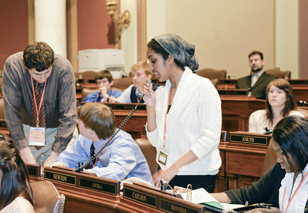 Nima Hassan, a junior at Fridley High School, proposes a bill during a youth in government assembly.