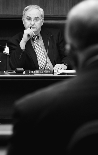 Rep. Lyndon Carlson, chairman of the House Finance Committee, listens as Tom Hanson, commissioner of Minnesota Management and Budget, presents Gov. Tim Pawlenty�s 2010-2011 biennial budget proposal Jan. 28 to a joint hearing of the House Finance and Ways and Means committees.