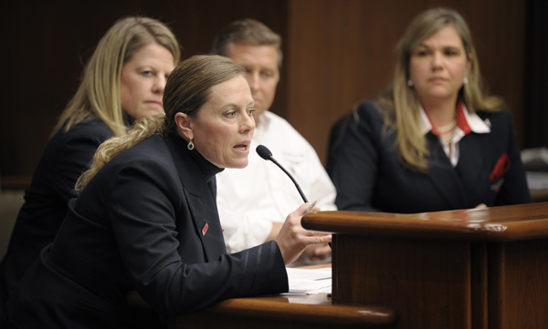 Dawn Shea, front, a Northwest Airlines cabin attendant, tells of her experience applying for unemployment during a Feb. 9 hearing of the House Higher Education and Workforce Development Finance and Policy Division. Other airline employees who testified are, background from left, Laurie Gandrud, Mike Ewald and Amy Lusty. (Photo by Tom Olmscheid)