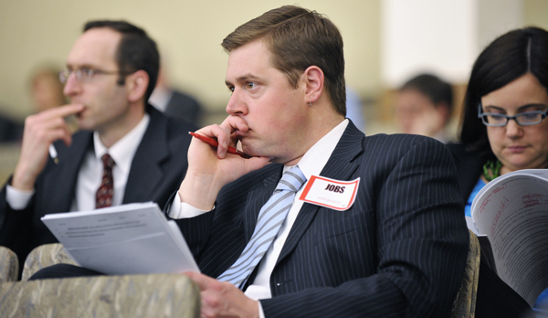 Kyle Markarios, political director of the North Central States Regional Council of Carpenters, listens March 15 as the House Taxes Committee hears a jobs creation bill. (Photo by Tom Olmscheid)