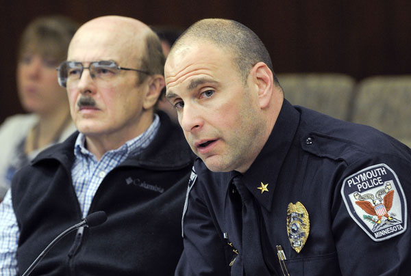 Joseph Olson, left, president of the Gun Owners Civil Rights Alliance of Minnesota, and Plymouth Police Chief Mike Goldstein testify before the House Public Safety Policy and Oversight Committee March 18 in support of a bill that would increase the criminal penalty for possessing dangerous weapons on school property. (Photo by Andrew VonBank)