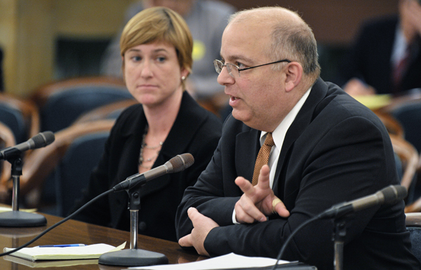 Minnesota Management & Budget Commissioner Tom Hanson, right, tells the LCPFP Subcommittee on a Balanced Budget April 27 that the $408 million Medicaid payment to the state will likely arrive after the Legislature adjourns. Legislative leaders and Gov. Tim Pawlenty have included the money in their budget-balancing plans. State Budget Director Kristin Dybdal, left, also testified. (Photo by Tom Olmscheid)