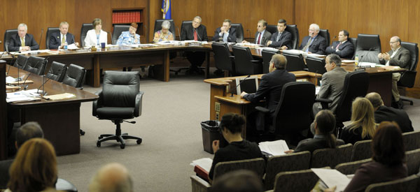 Members of the House State and Local Government Operations Reform, Technology and Elections Committee listen April 27 to testimony on a bill that would make several changes to the open meeting law. (Photo by Andrew VonBank)