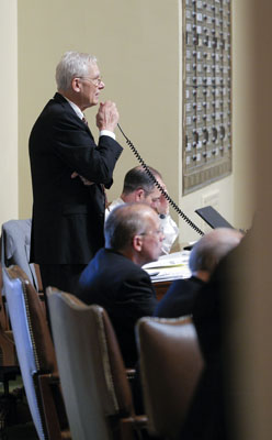Rep. Thomas Huntley presents the omnibus health and human services bill on the House floor May 4. (Photo by Andrew VonBank)