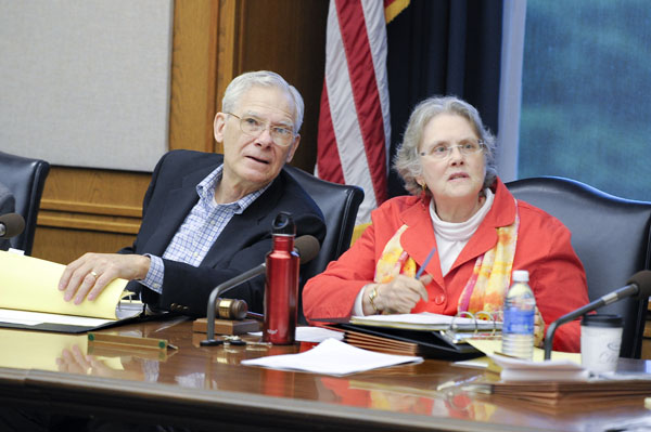 Rep. Thomas Huntley and Sen. Linda Berglin listen to the side-by-side comparison of the House and Senate health and human services bills during a May 7 conference committee meeting. (Photo by Andrew VonBank)