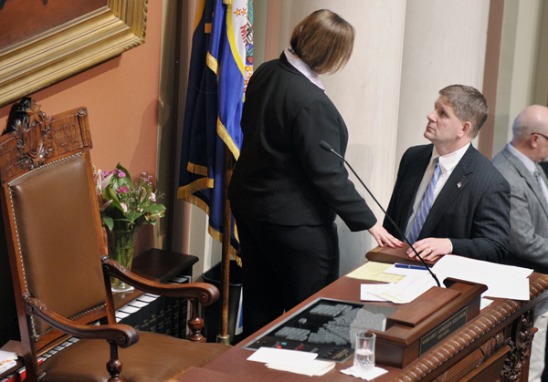 House Speaker Margaret Anderson Kelliher talks with House Minority Leader Kurt Zellers prior to the House taking up a budget-balancing bill during a one-day special session May 17. (Photo by Tom Olmscheid)