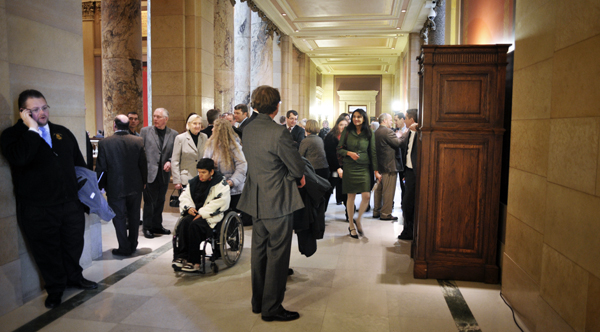 The hallways outside the House and Senate chambers were filled with lobbyists and well-wishers when the 87th legislative session began Jan. 4. (Photo by Tom Olmscheid)