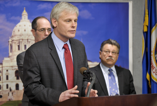 House Minority Leader Paul Thissen, center, reacts to the introduction of the first two House files. Rep. Tim Mahoney, left, and 
Rep. Tom Rukavina also spoke at a Jan. 10 press conference. (Photo by Tom Olmscheid)