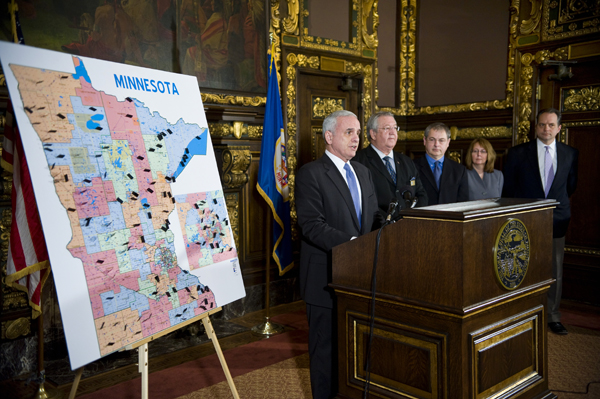 At a Jan. 31 news conference, Gov. Mark Dayton, left, announces a $1 billion bonding proposal for projects around the state. Others attending the news conference include, from left, Rochester Mayor Ardell Brede; Dr. Robert Hoerr, co-founder of Nanocopoeia, Inc.; Kristin Hanson, Minnesota Management & Budget assistant commissioner for Debt Management and Treasury; and Jim Schowalter, MMB Commissioner. (Photo by Tom Olmscheid)