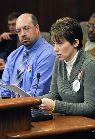 Travis and Lynn Johnson, whose 2-year-old daughter, Emily, was killed by a 13-year-old boy, testify Feb. 10 before the House Public Safety and Crime Prevention Policy and Finance Committee in support of a bill that would lower the age of adult certification and extended jurisdiction juvenile prosecution for juveniles. (Photo by Andrew VonBank)