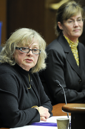 Shirley Brekken, left, executive director of the Board of Nursing, testifies before the House Health and Human Services Reform Committee March 9 in support of a bill that would provide nurse licensure compact and appointments.  Rep. Kim Norton, right, sponsors the bill.  (Photo by Andrew VonBank)