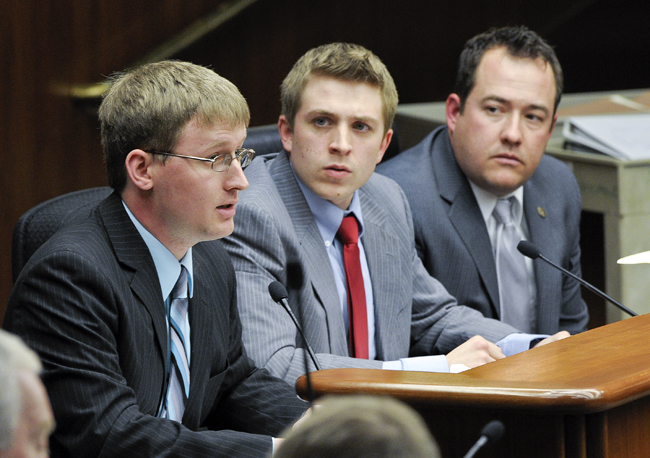 Travis Johnson, president of the Minnesota State College Student Association, left, and Geoff Dittberner, the associations vice president, testify before the House Higher Education Policy and Finance Committee March 8 about a bill that would freeze tuition for Minnesota undergraduates attending a MnSCU institution or the University of Minnesota in fiscal years 2012 and 2013. Rep. Chris Swedzinski, right, is the bill sponsor. (Photo by Andrew VonBank)