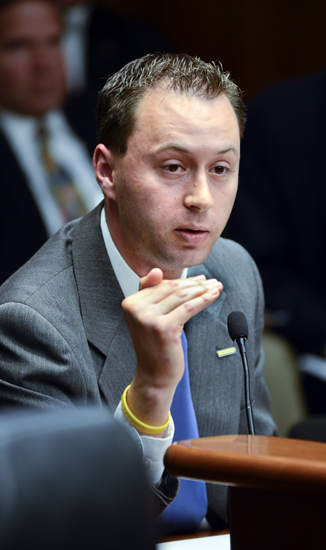 Cancer survivor Ryan Flynn testifies before the House Health and Human Services Reform Committee April 26 in support of a bill that would repeal the radiation therapy facility construction moratorium. (Photo by Andrew VonBank)