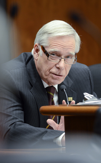 University of Minnesota President Robert Bruininks testifies before the omnibus higher education finance conference committee May 3 about how the proposed funding reductions would affect the university and the state. (Photo by Andrew VonBank)