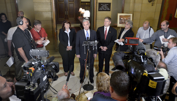 Senate Majority Leader Amy Koch, from left, Gov. Mark Dayton and House Speaker Kurt Zellers emerge from budget talks July 14 to report the framework of an agreement had been reached to end the state government shutdown. (Photo by Andrew VonBank)