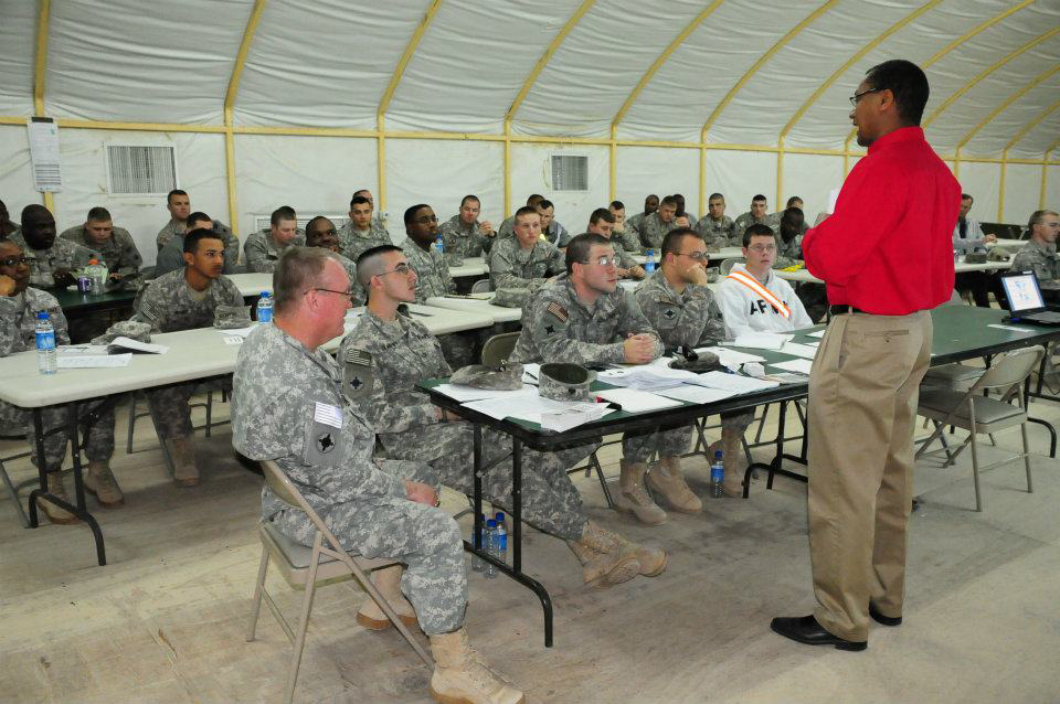 Marvin Hamilton, right, a Target Corporation executive and former U.S. Army officer, speaks to a group of Minnesota National Guard soldiers in Kuwait. Hamilton was part of an “Employment Resource Team” that visited the troops in March to prepare soldiers to look for jobs after their deployment ends. (Photo courtesy Minnesota National Guard)