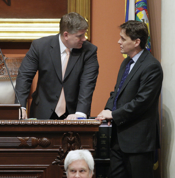 House Speaker Kurt Zellers (left) speaks with House Majority Leader Matt Dean on the House floor April 23. (Photo by Paul Battaglia)
