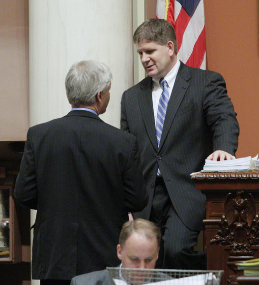 House Speaker Kurt Zellers (right) speaks with House Minority Leader Paul Thissen on the House floor April 23. (Photo by Paul Battaglia)