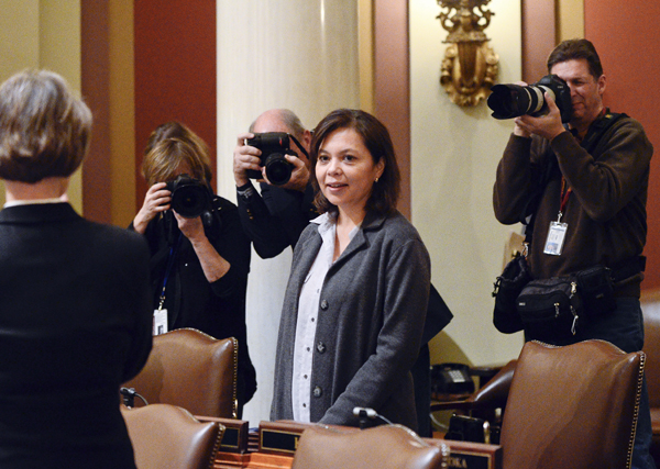 Rep. Susan Allen, the newest member of the Minnesota House of Representatives, is welcomed on the House floor by her colleagues Jan. 24. (Photo by Andrew VonBank)
