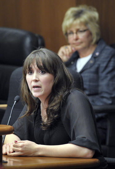Dana Akre, food program monitor for the Minnesota Licensed Family Child Care Association, testifies before the House Health and Human Services Reform Committee Jan. 31 in support of a bill that would modify child care assistance fund payments.  Rep. Kathy Lohmer, back, is the bills sponsor. (Photo by Andrew VonBank)