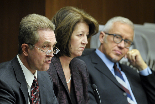 From left, Dennis Benson, executive director of the Minnesota Sex Offender Program; Human Services Commissioner Lucinda Jesson; and George Widseth, a prosecutor in the Hennepin County Attorneys Office, provide a provisional discharge process review before the House Health and Human Services Reform Committee Feb. 15. (Photo by Andrew VonBank)