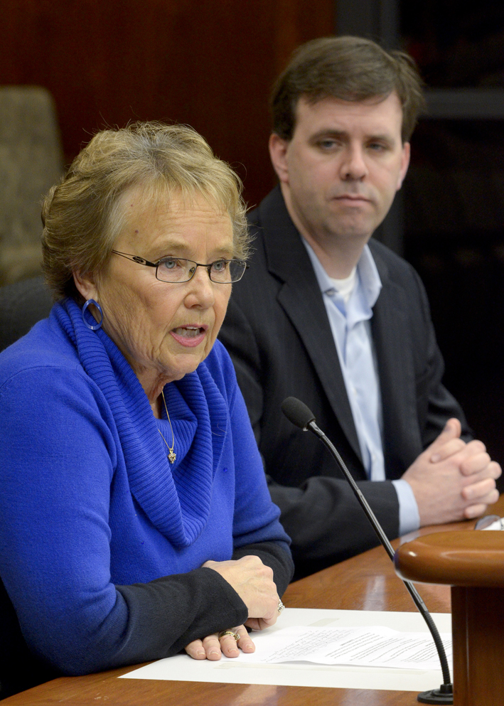 Nancy Johnson, president of Minnesotans for Safe Driving, testifies before the House Judiciary Policy and Finance Committee March 8 in support of a bill that would make the penalty for careless driving resulting in a death a gross misdemeanor.  Rep. Pat Garofalo, right, sponsors the bill. (Photo by Andrew VonBank)