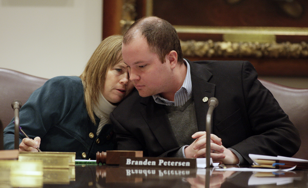 Rep. Branden Petersen and Sen. Pam Wolf confer during the March 26 conference committee on the so called “Last-In, First-Out” education bill. (Photo by Paul Battaglia)